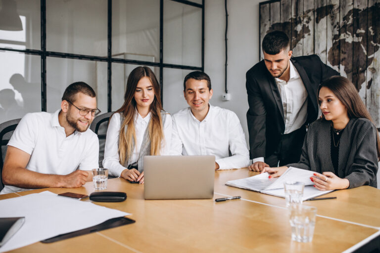 group of people working out business plan in an office
